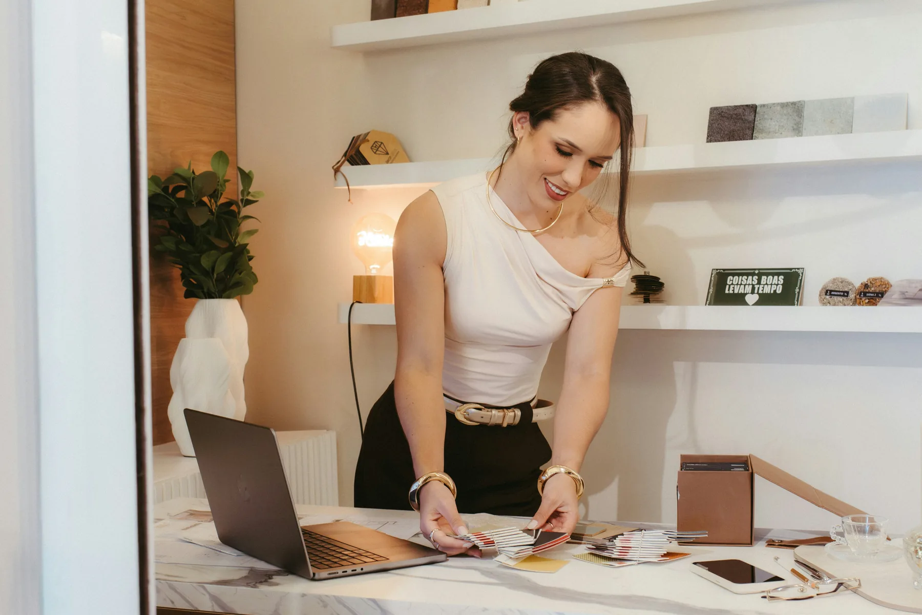 Designer selecting colour and material samples at a studio table