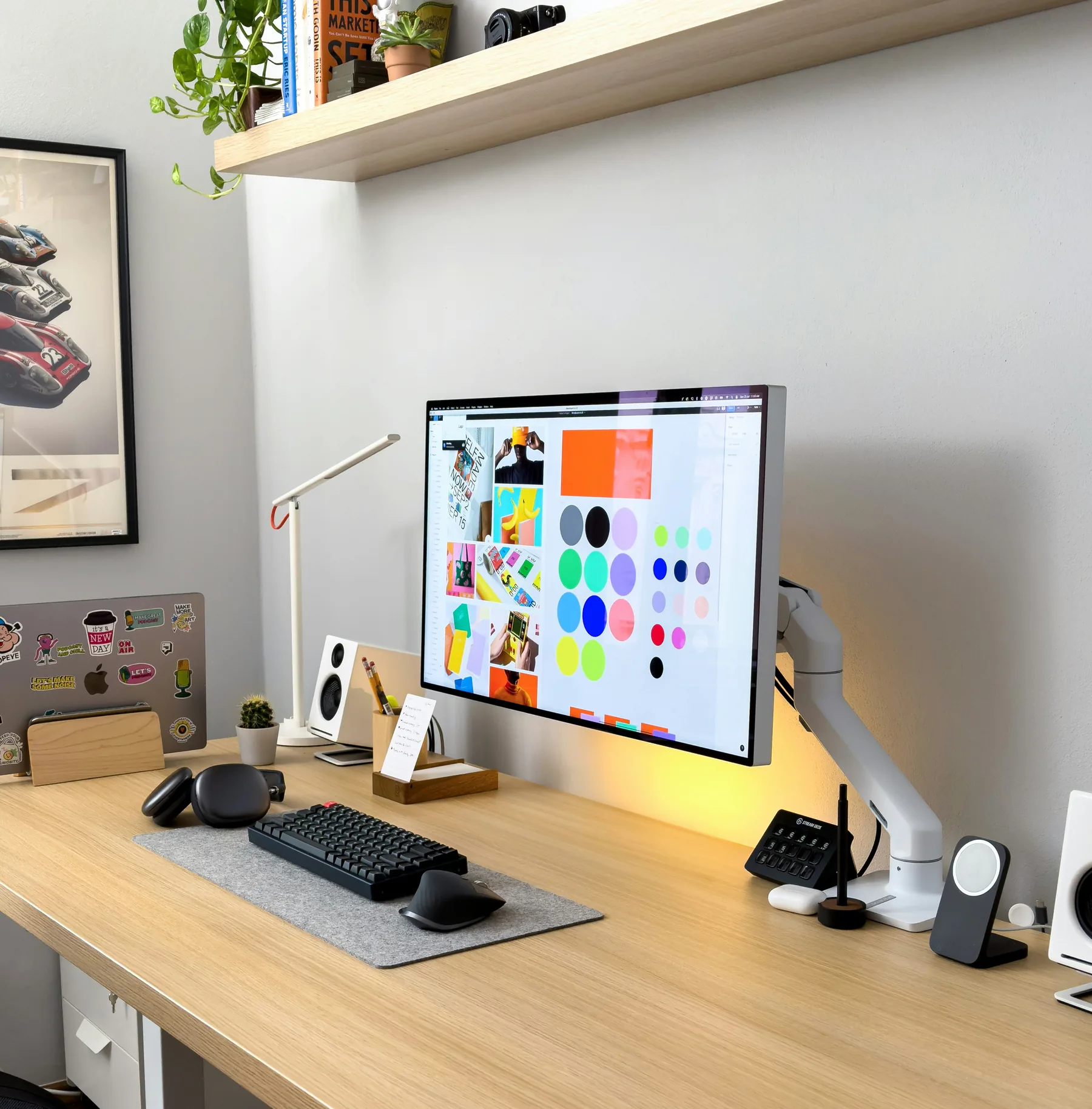 Modern creative workspace with a brand interface on screen